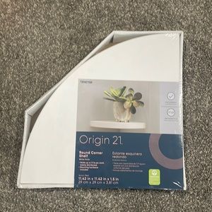 Two white floating corner shelves